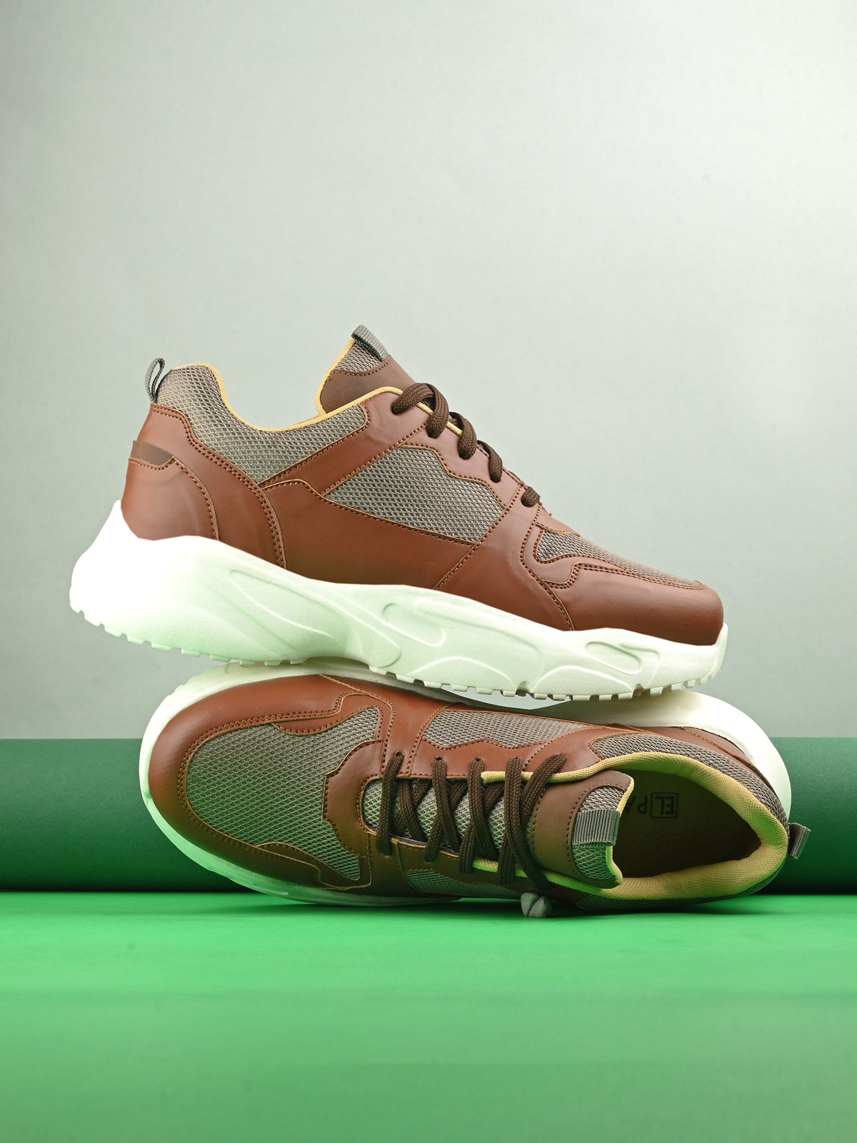 brown and grey mesh Men's casual sneakers with a chunky white sole, offering a stylish and comfortable look.