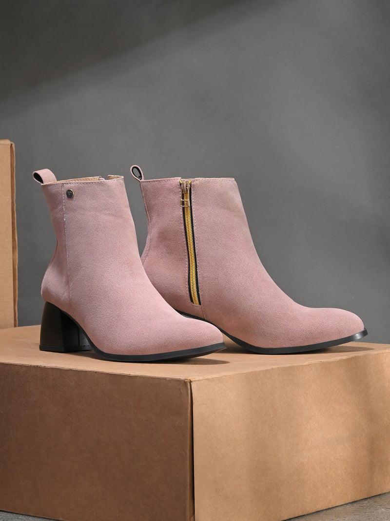 Light pink Suede ankle boots for women with a block heel and a sleek, minimalist design.