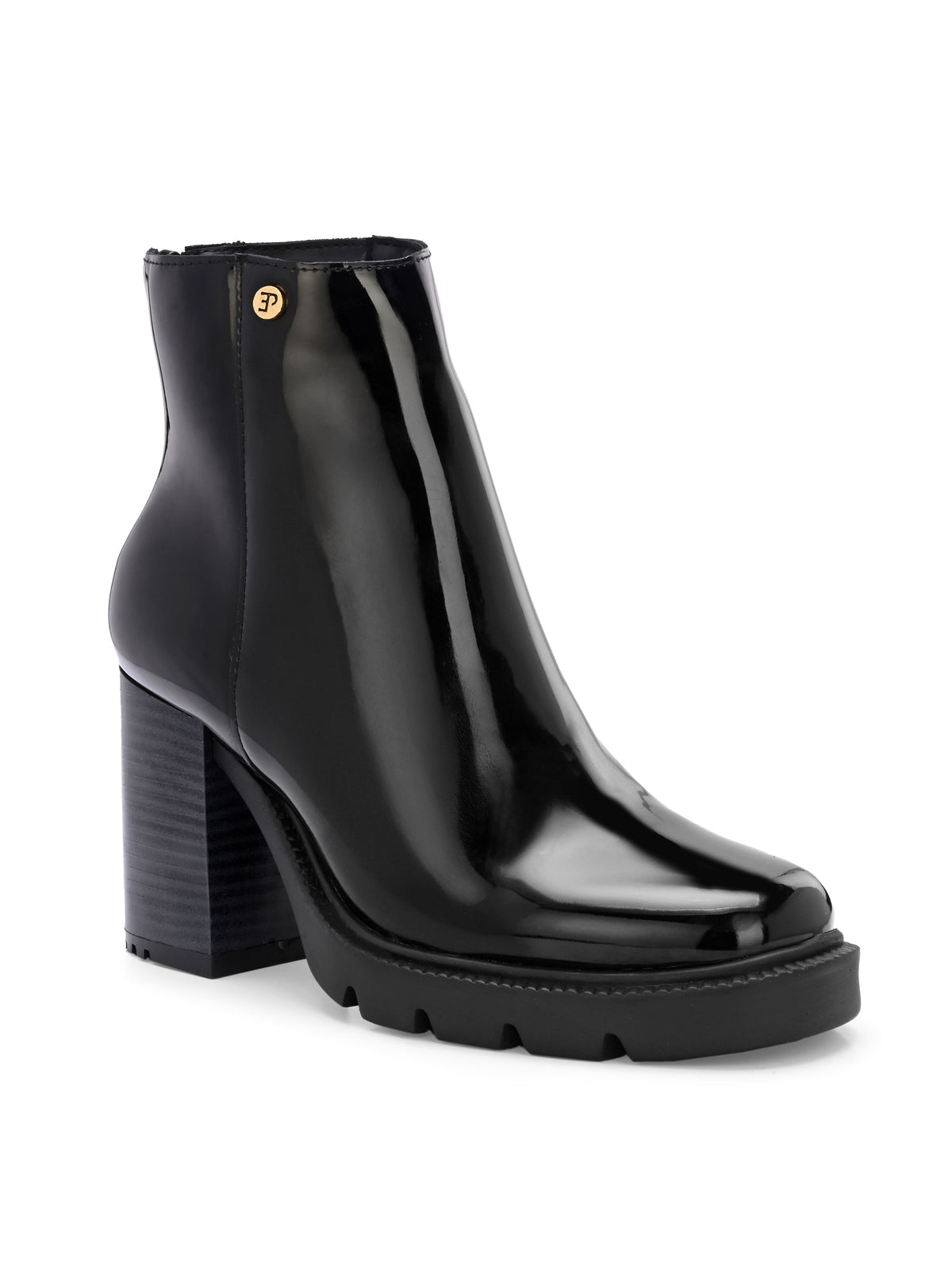 Glossy black patent leather ankle boot with a chunky block heel, lug sole, and a gold logo detail near the collar.