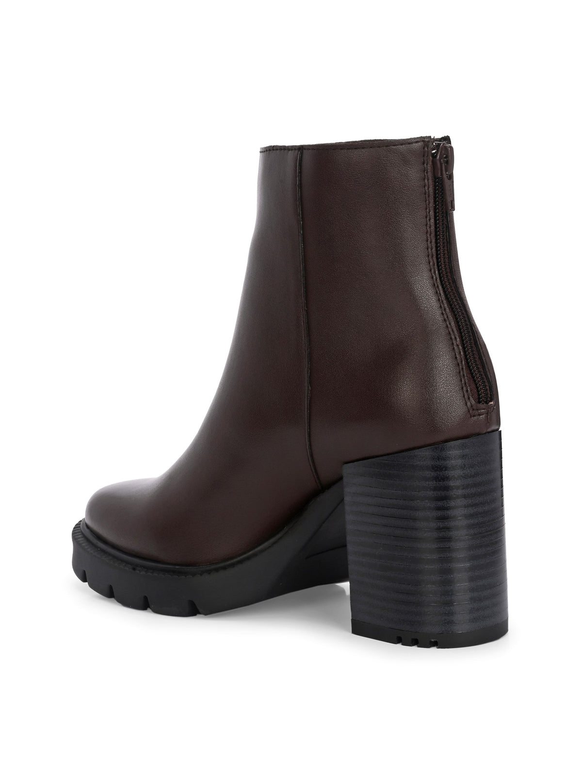 Glossy brown patent leather ankle boot with a chunky block heel, lug sole, and a gold logo detail near the collar.