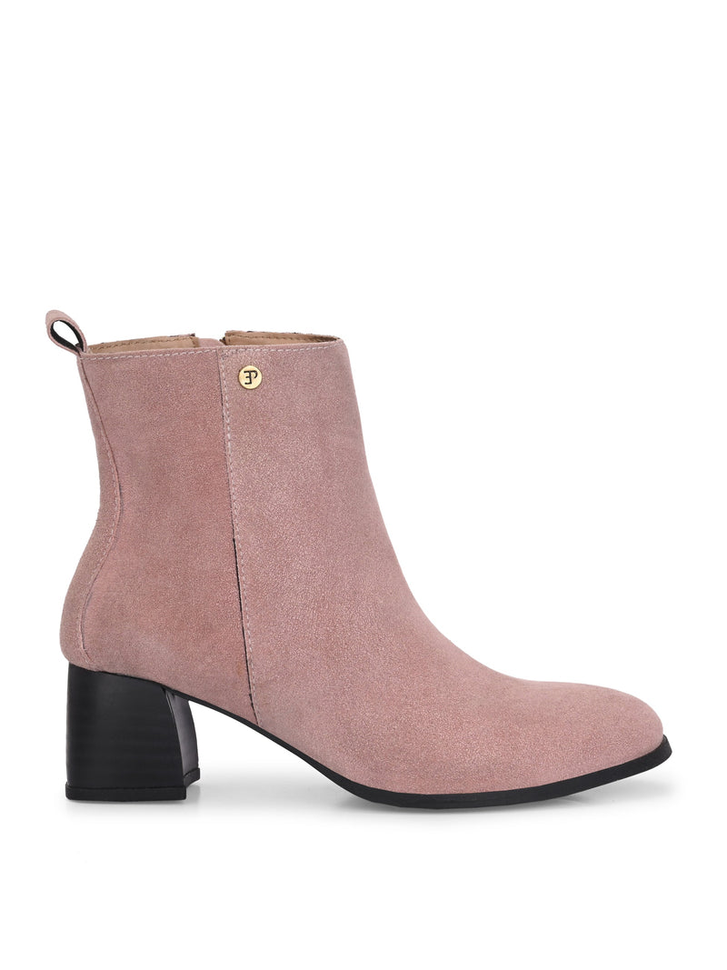 Light pink heigh top boot with a block heel and a sleek, minimalist design.