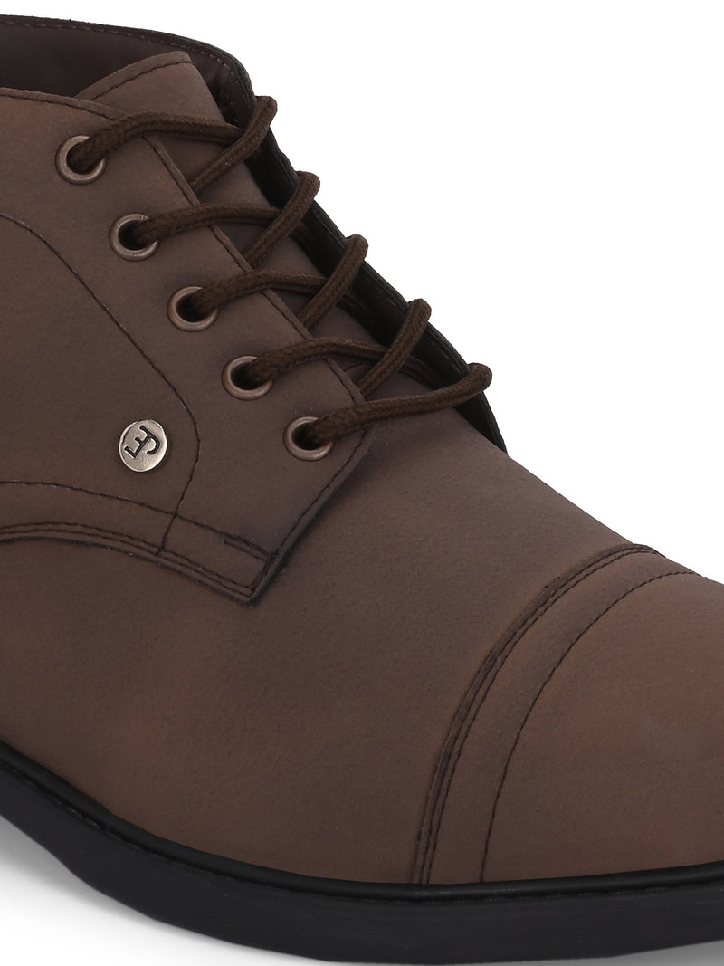 Faux leather casual boots with a cap toe, sleek design, metal eyelets, and a small brand logo near the ankle.