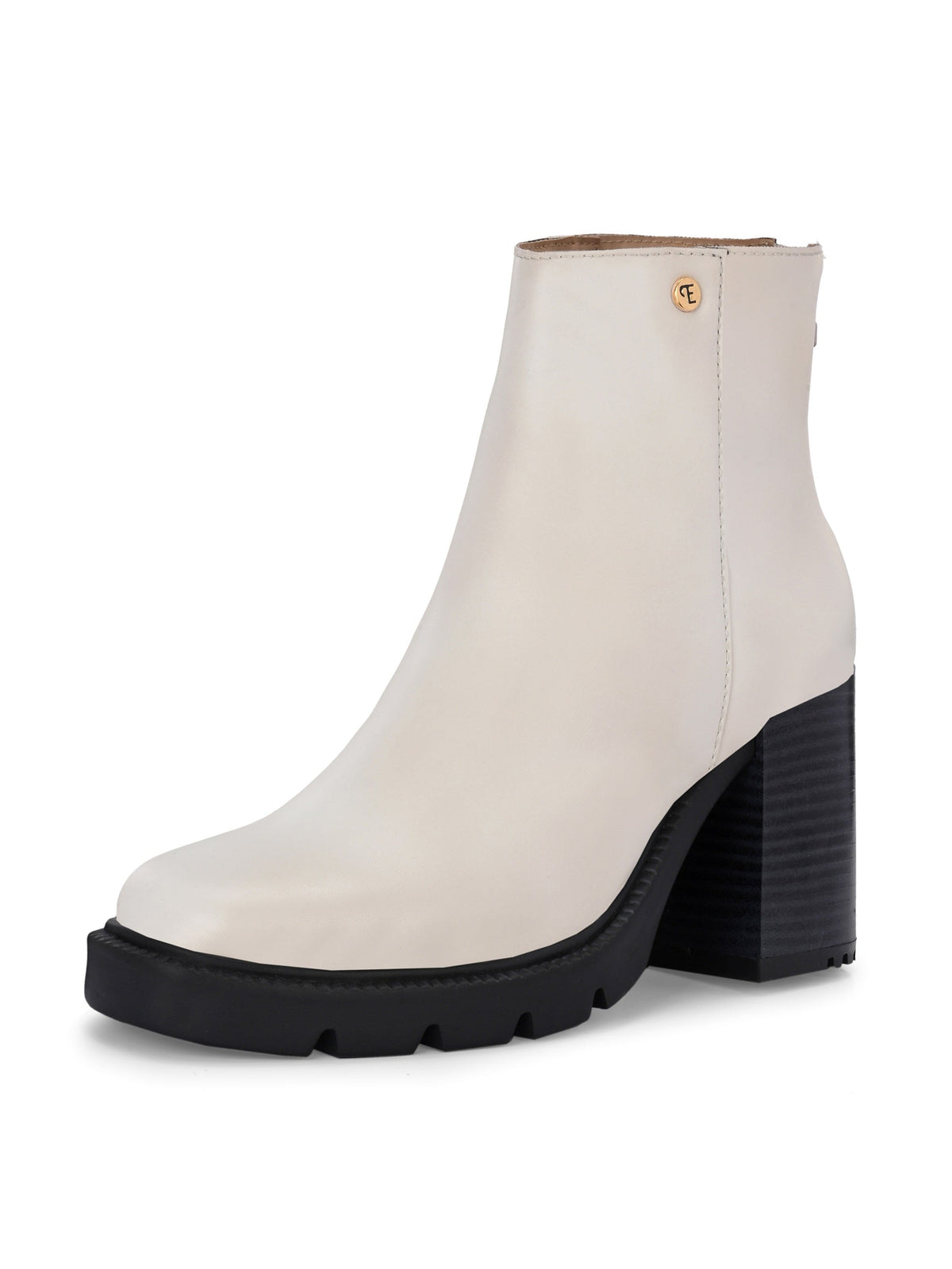 Glossy beige patent leather ankle boot with a chunky block heel, lug sole, and a gold logo detail near the collar.