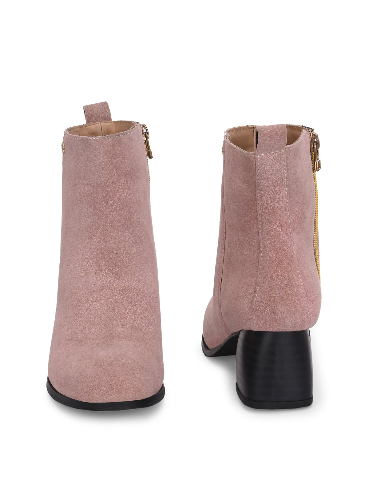 Light pink heigh top boot with a block heel and a sleek, minimalist design.