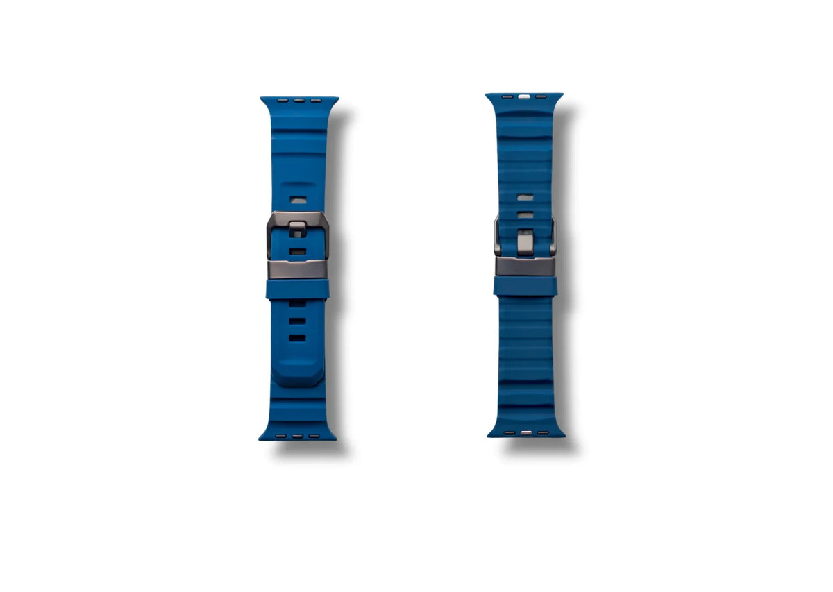 Two blue apple watch straps with silver buckles on a white background