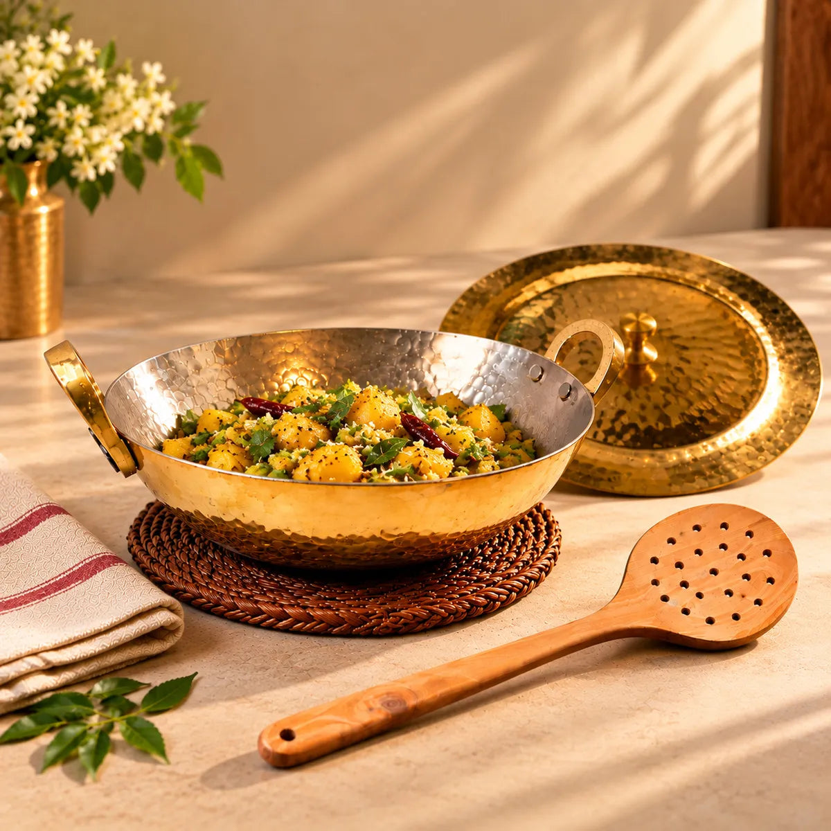 Hammered brass kadai extra large with potato stir fry, lid and neem wood skimmer. Zishta Festive Cookware Combos.
