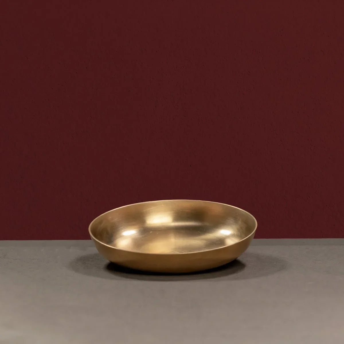 Kansa Snack Plate in a slightly slanting position-Zishta Traditional Bronze Serveware